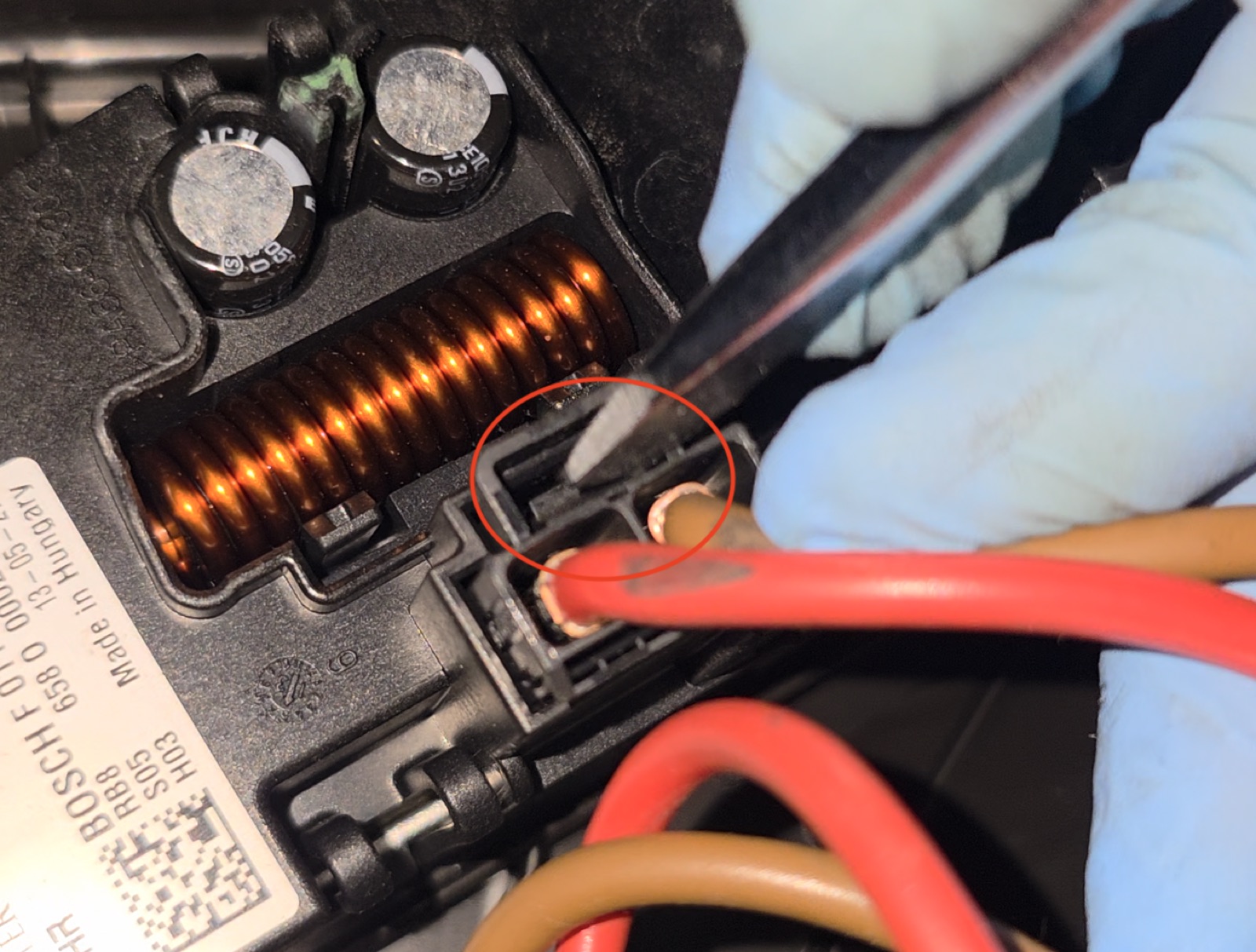 Step 13: Release the two wiring harnesses